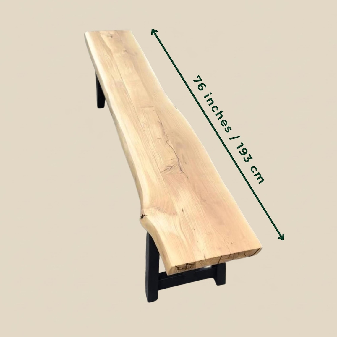 A live-edge wooden bench with a black metal base, shown on a light beige background with a green dimension arrow indicating a length of 76 inches (193 cm).