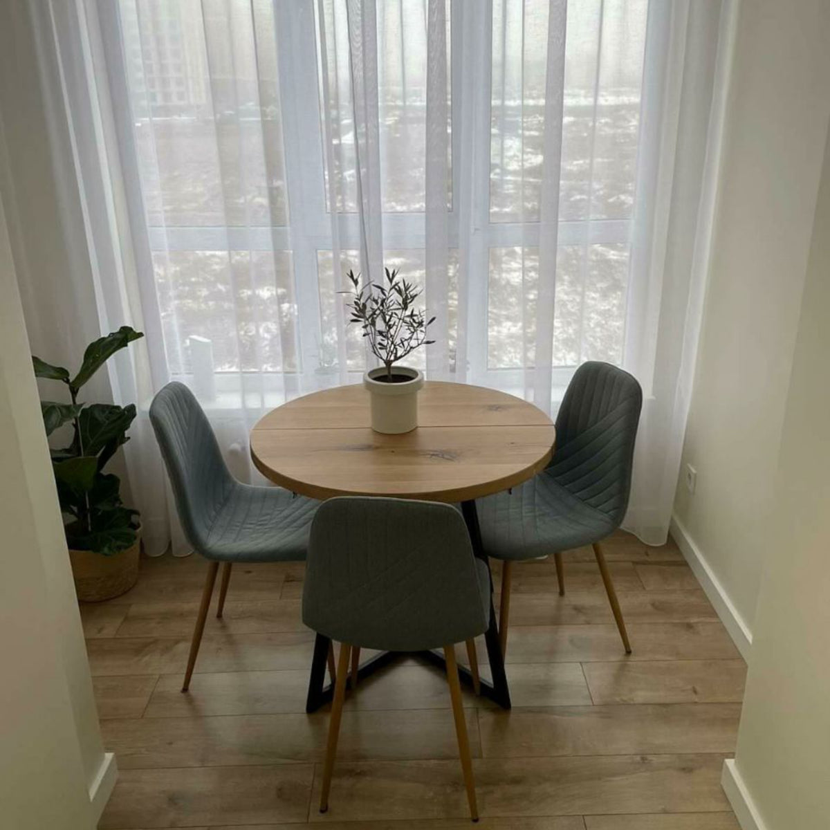 Round Extendable Oak Dining Table with Metal Base