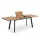A rustic wooden extendable desk with black metal legs, shown partially extended on a clean white background.